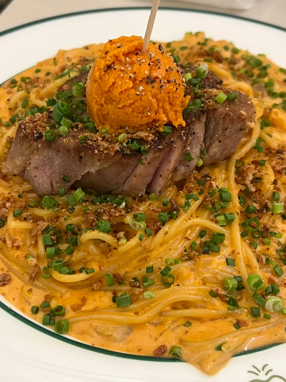Gochujang butter pasta topped with gochujang butter