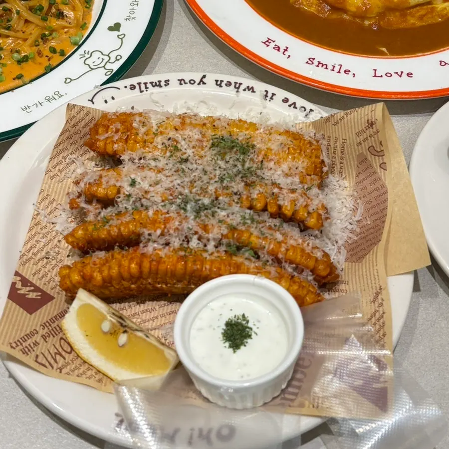 Side dish plate of corn fritters at Omil Hongdae