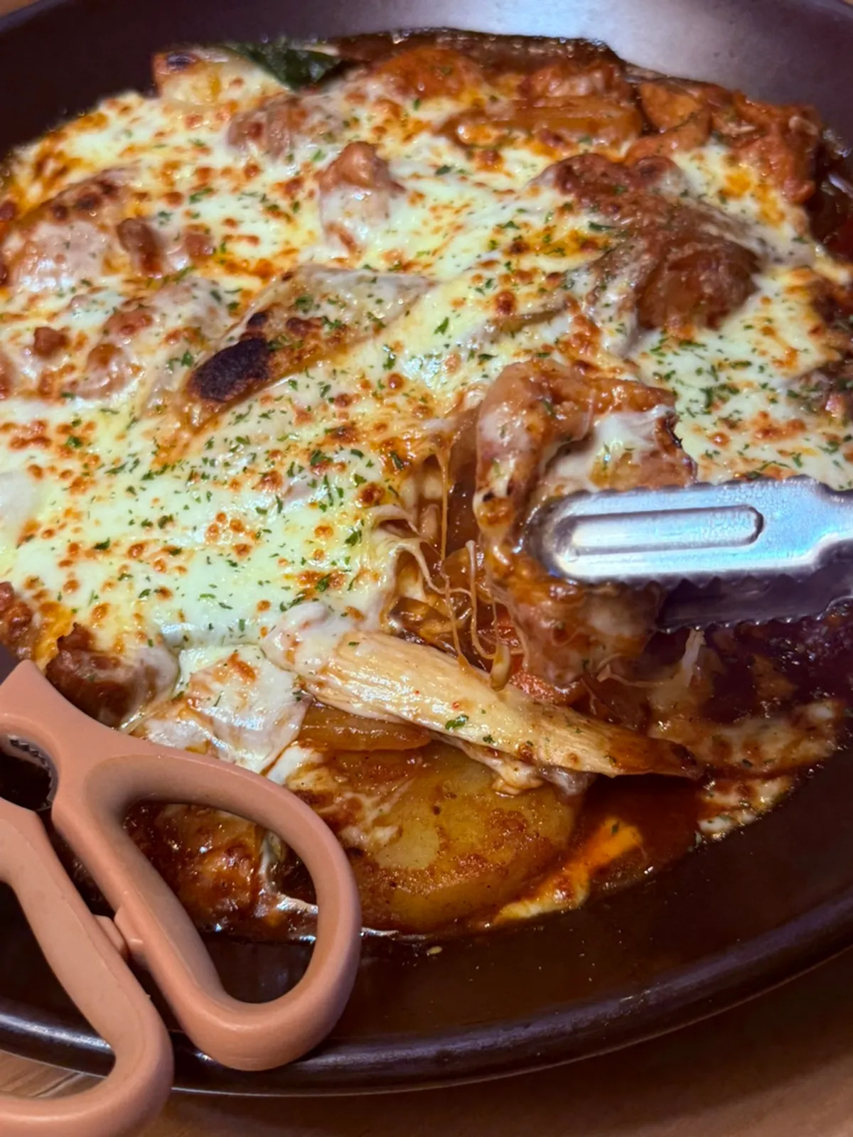 Gochujang jjimdak thickly covered with mozzarella cheese