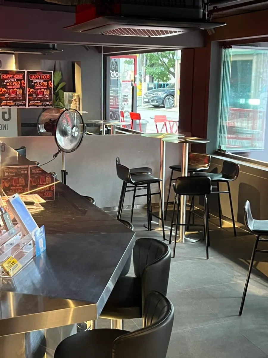 Long bar table and tall stools on the first floor