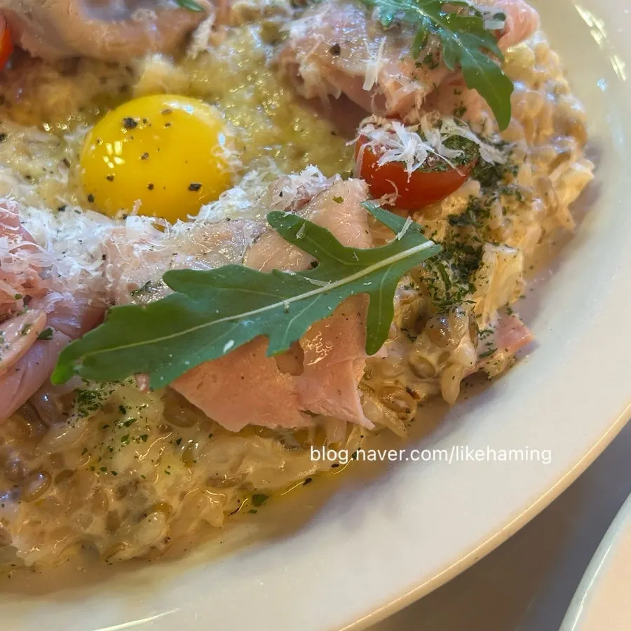 Truffle risotto topped with jambon ham and egg yolk