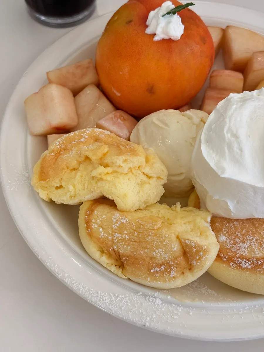 A big spoonful of soufflé and whipped cream together