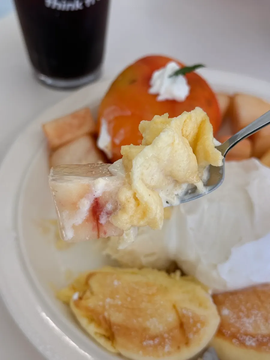 Fresh peach piled generously on top of the soufflé