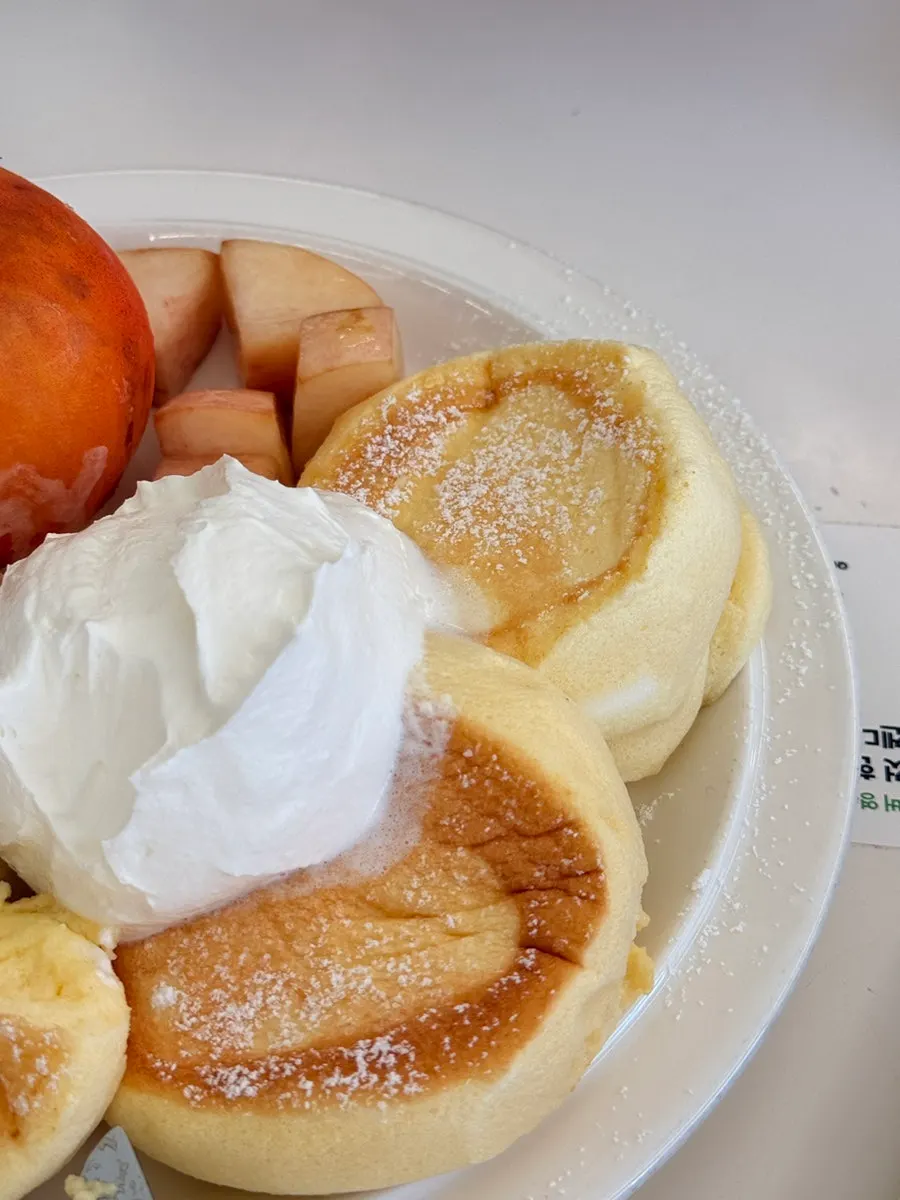 Soft soufflé paired with peach slices