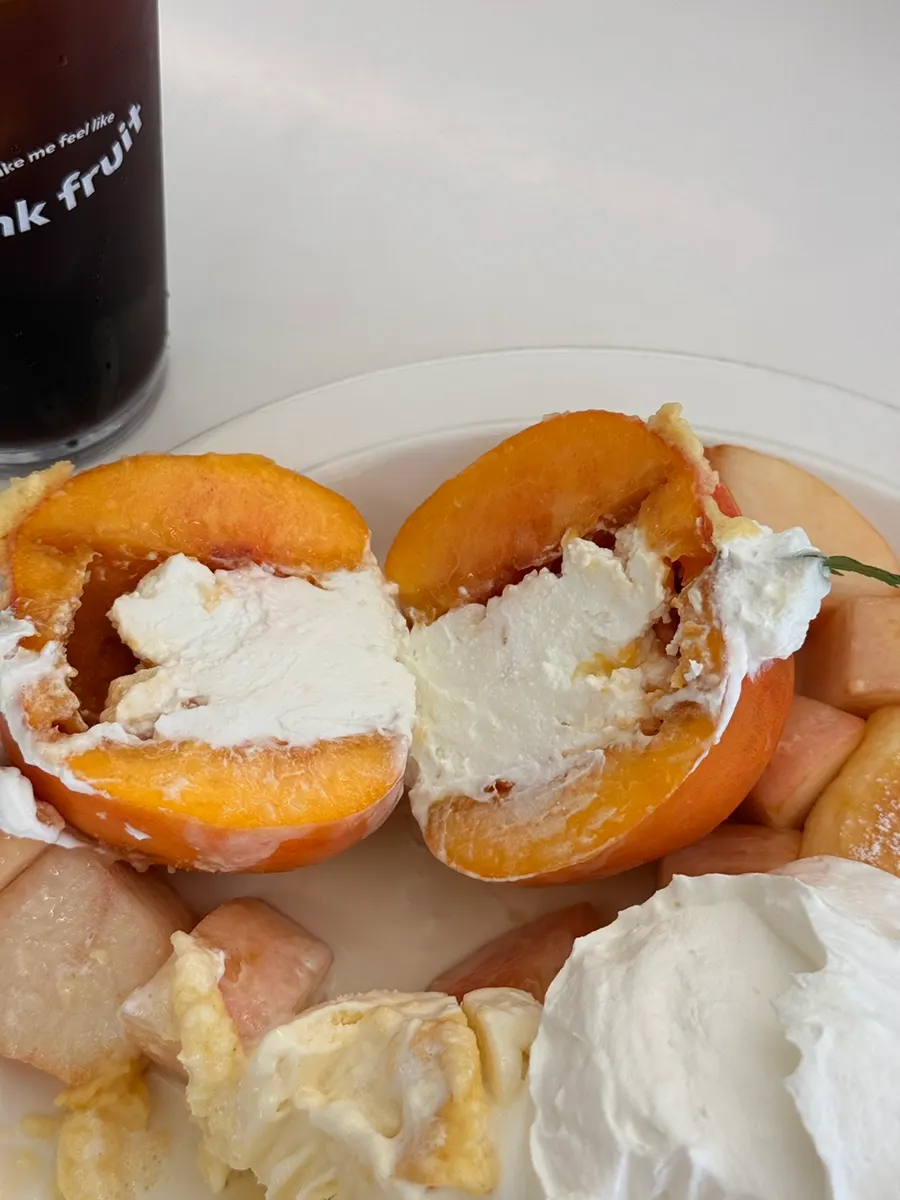 Whole yellow peach filled with Greek yogurt