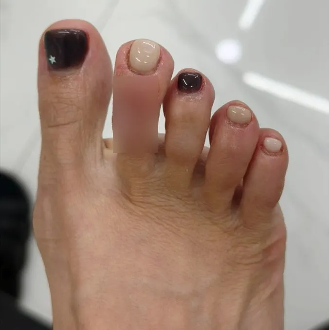 Final close-up of the neatly finished autumn pedicure