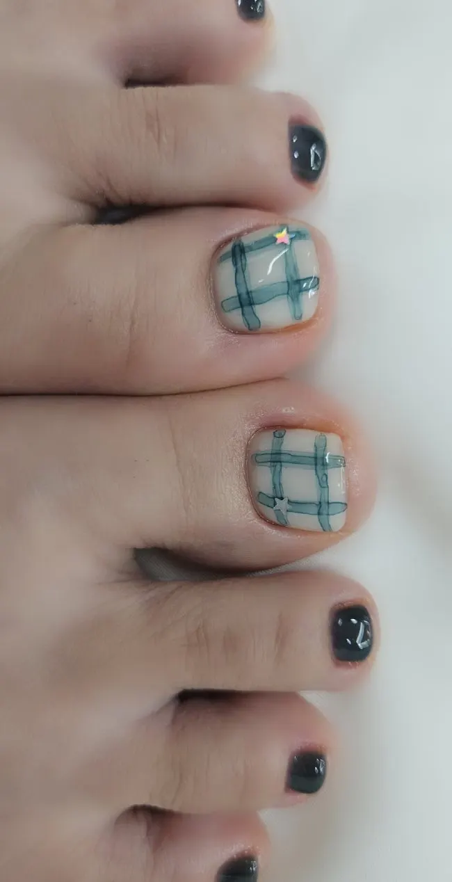 Finished pedicure in autumn-toned colors