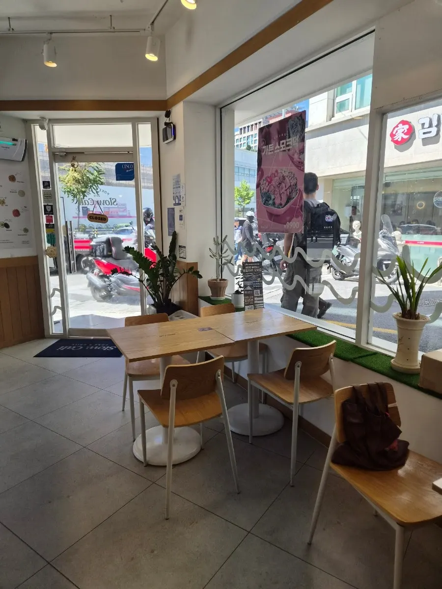 Indoor tables at Slow Cali Hongdae Entrance Station Branch