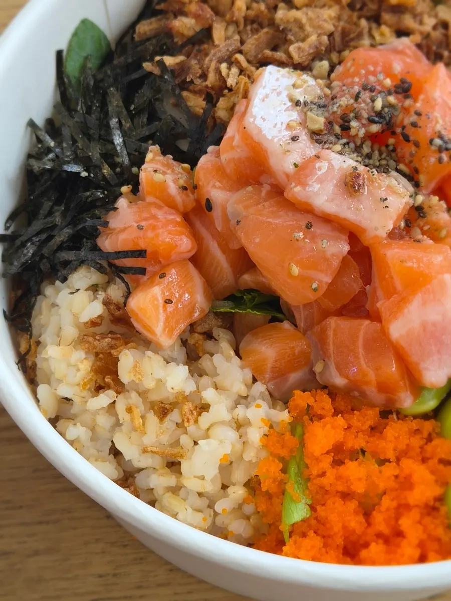 Salmon poke bowl with spicy sauce