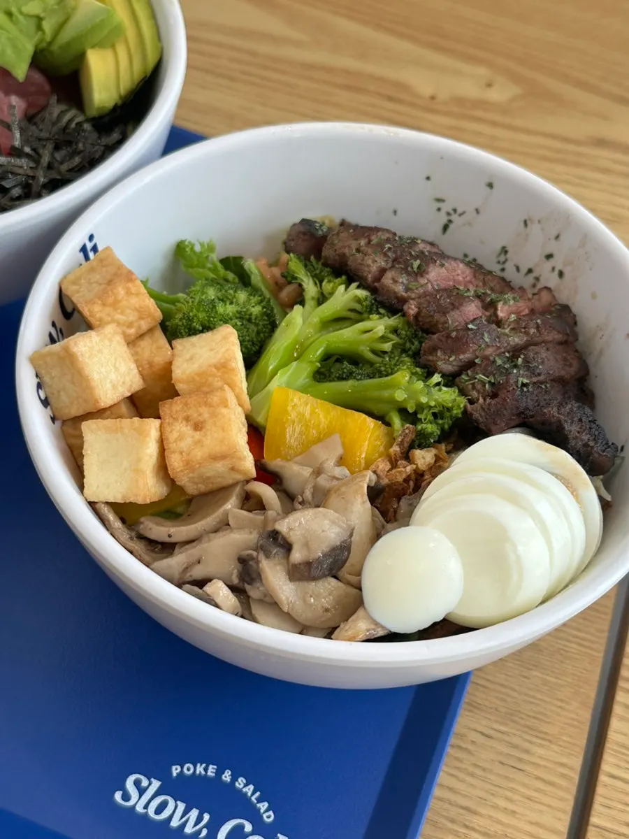 Steak bowl with grilled mushroom, egg, and tofu added