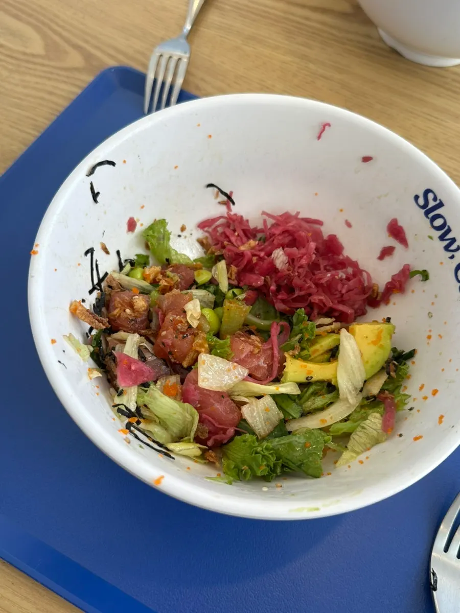 A spoonful of poke with avocado and tuna together