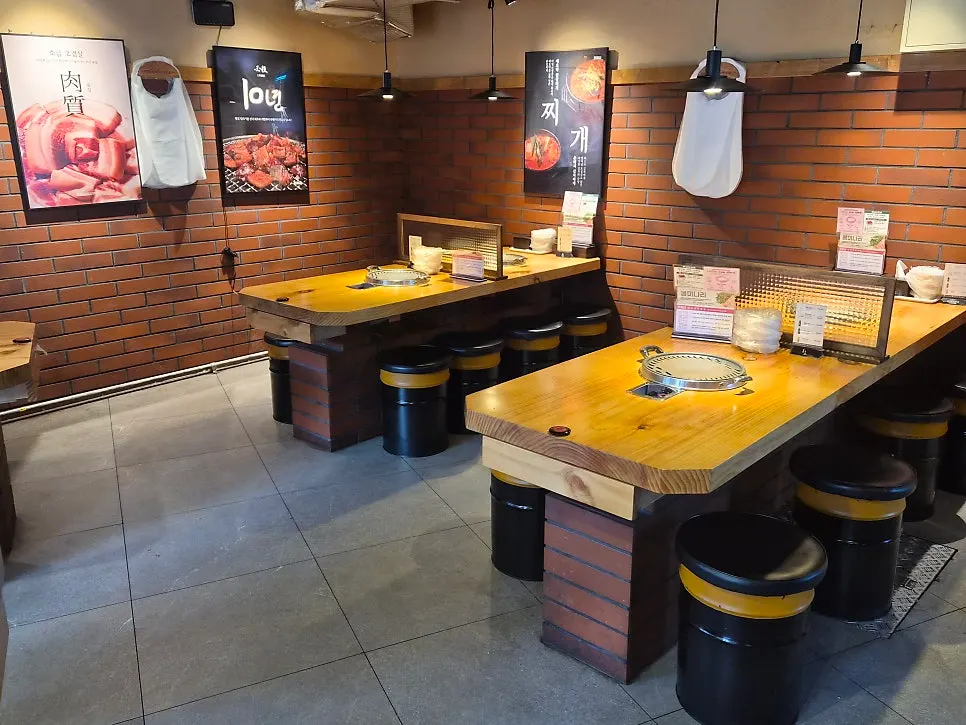 Interior with brick walls and solid wood slab tables