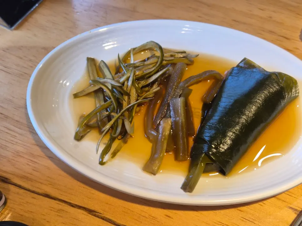 Chive namul and seaweed wraps served on a separate plate