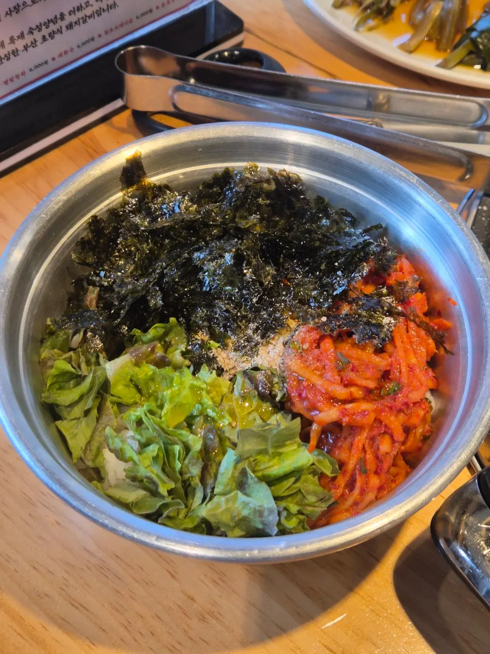 Mu-saengchae daecheopbap topped with radish salad, lettuce, and seaweed