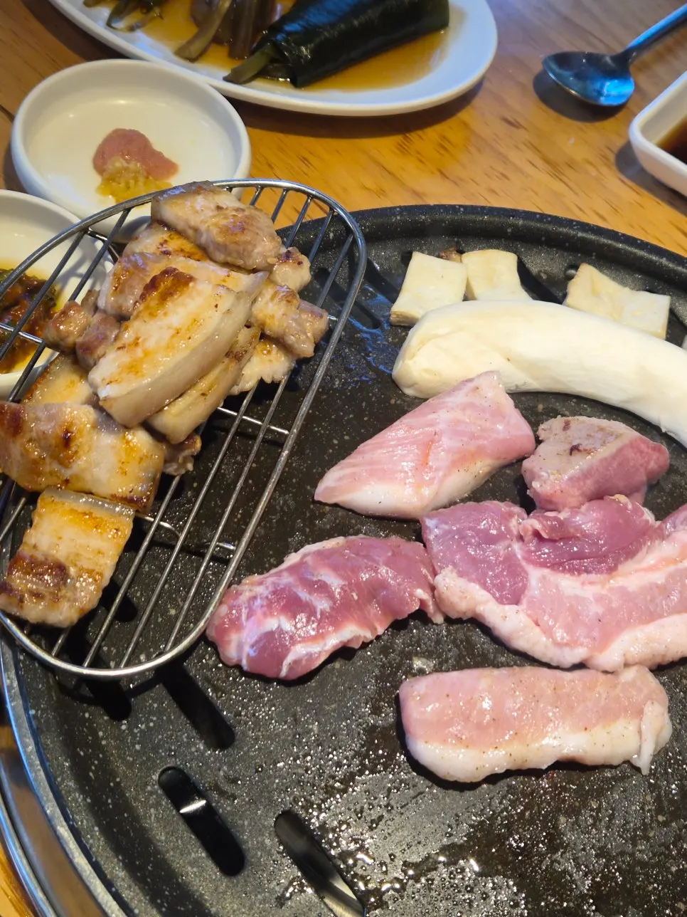 A cooked piece of ogyeopsal placed on a plate