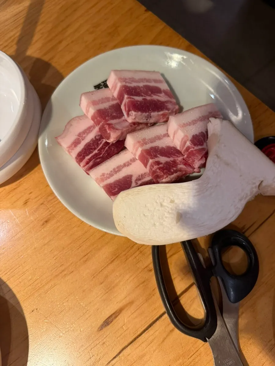 Salted ogyeopsal for two served on a plate