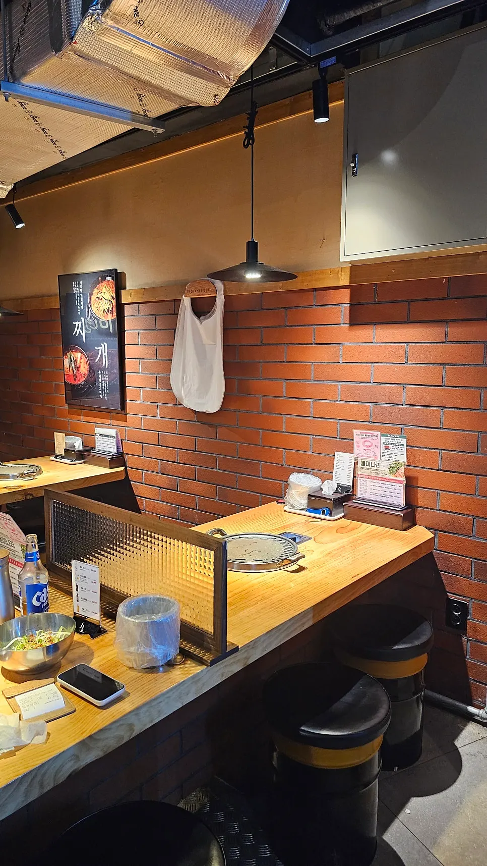 Indoor seating with brick walls and soft lighting