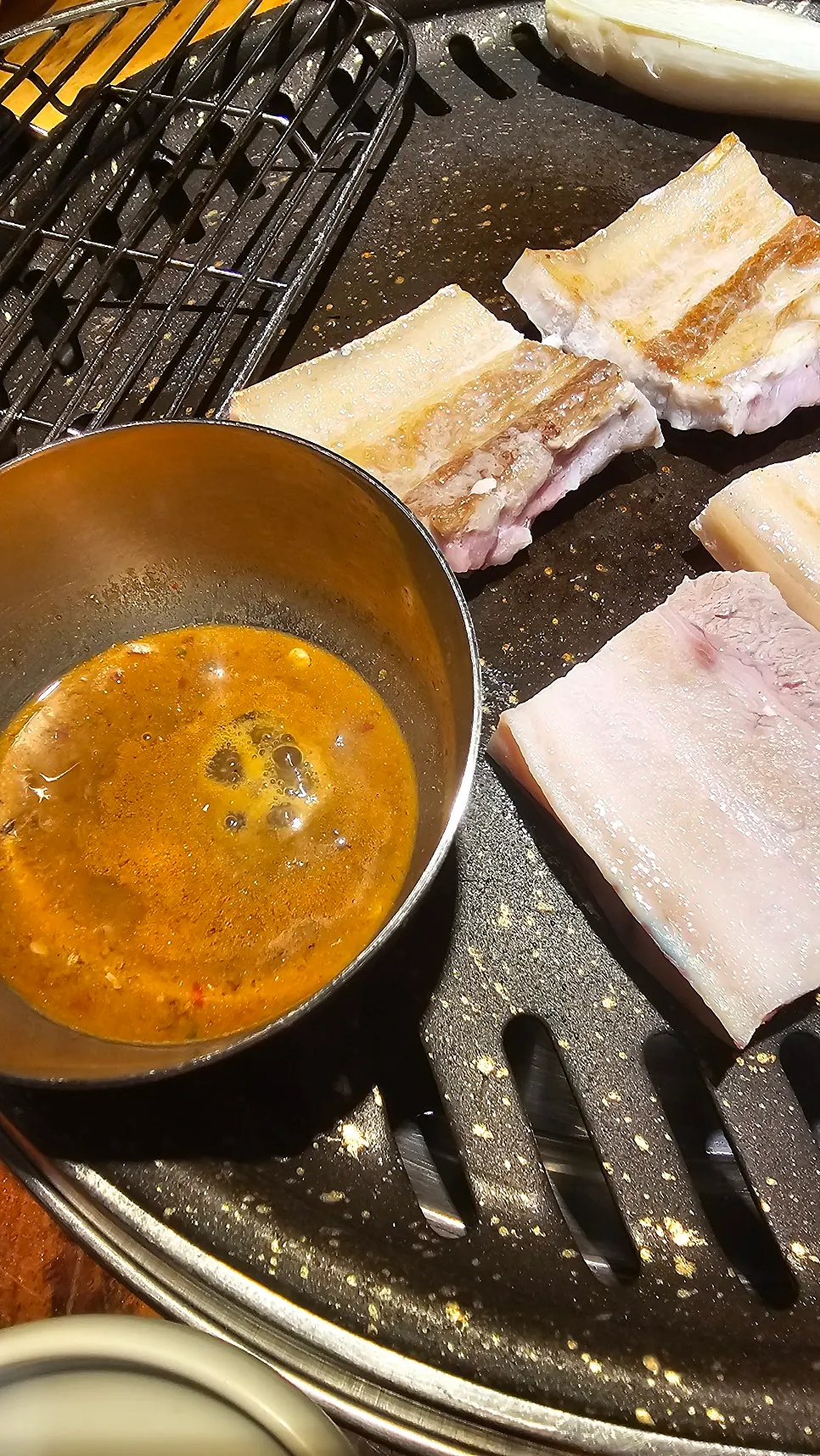 Pork belly and fermented anchovy sauce on the grill
