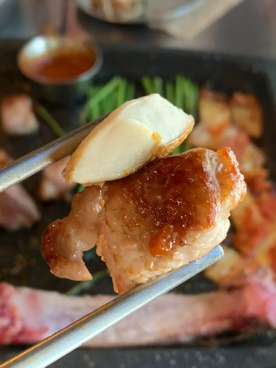 A piece of pork neck, crisp outside and juicy inside