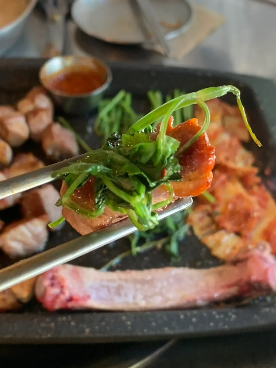 Grilled pork neck with accompanying dishes