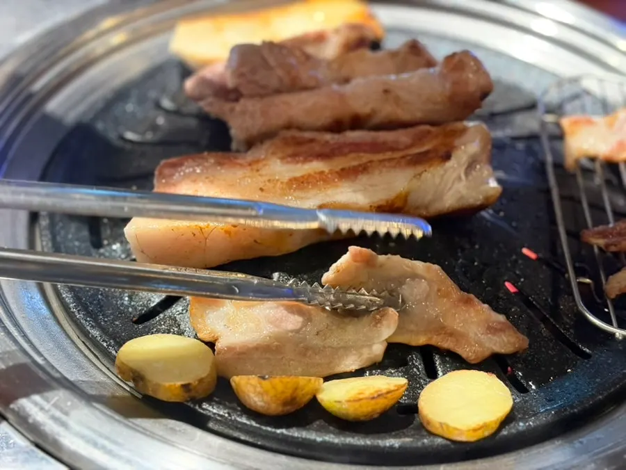 Meat and potatoes grilling on the grill