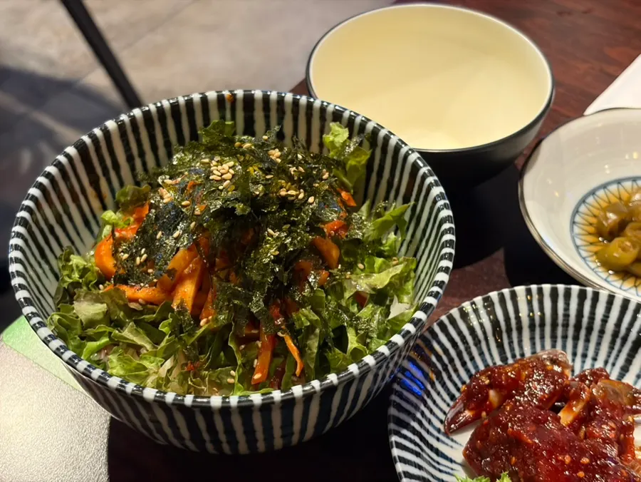 Tangy bibim guksu served with grilled meat