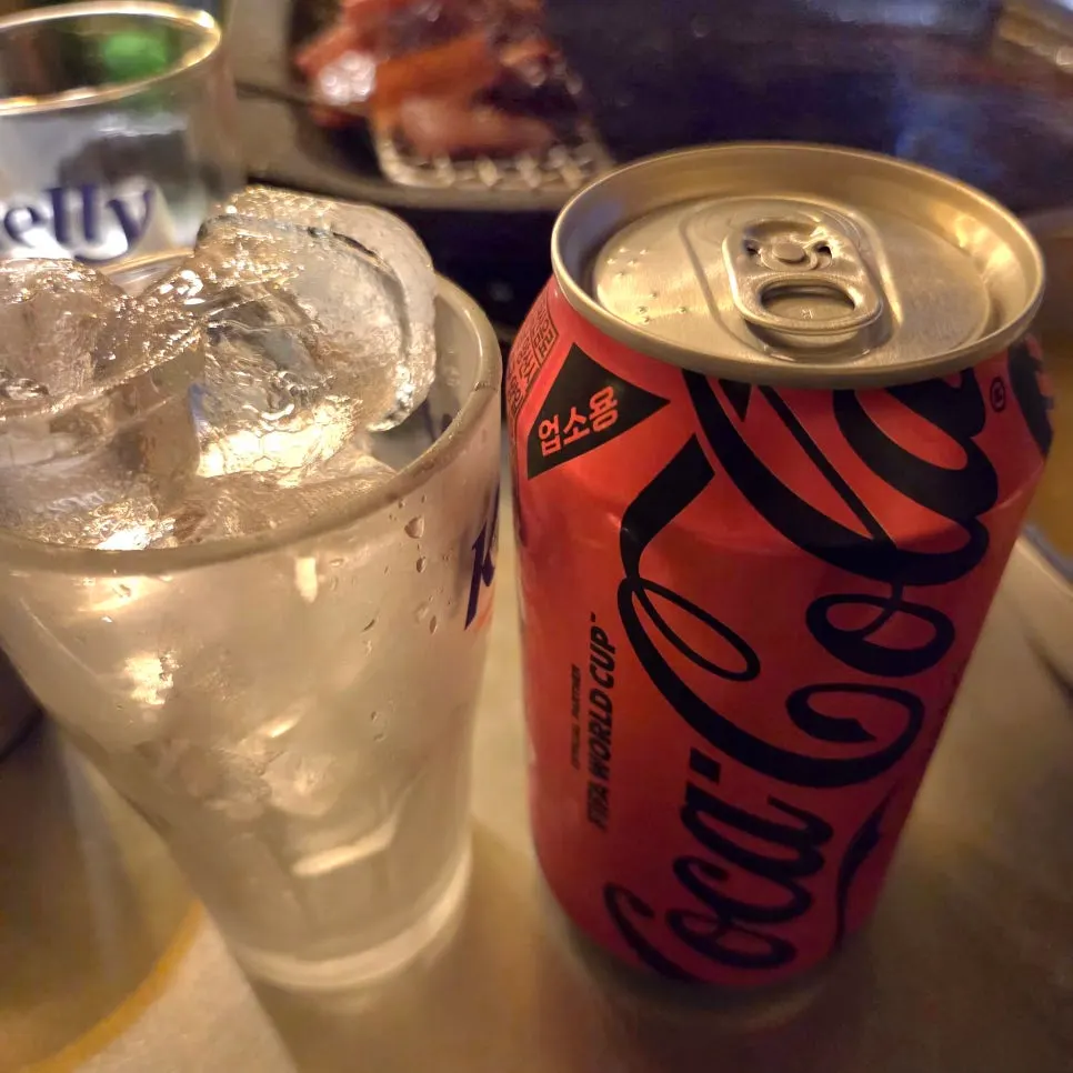 Ice-filled cup and cola