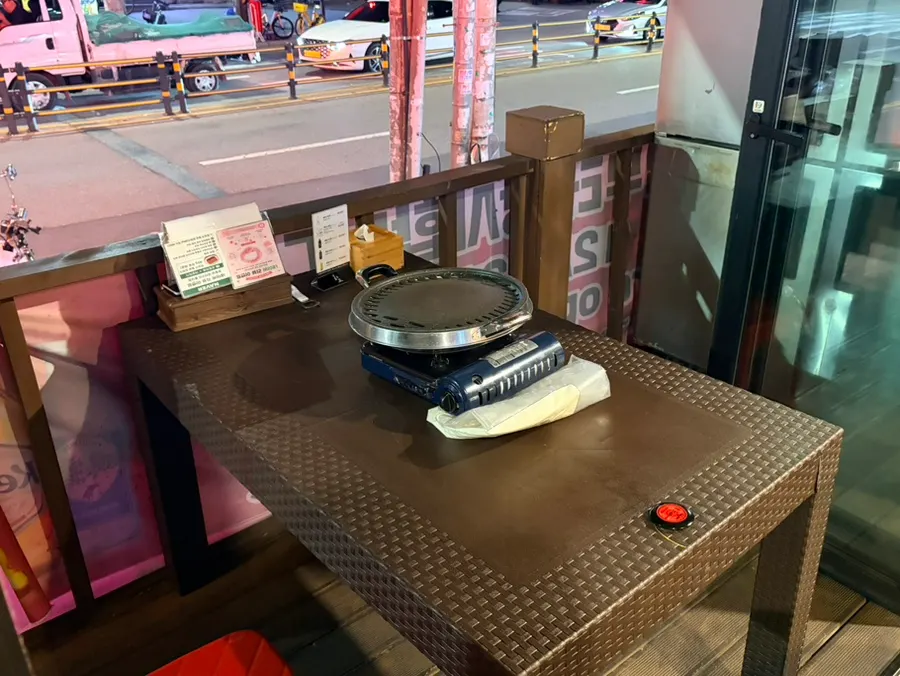 Outdoor table seating at Chopilsal Pork Grill Hongdae Branch