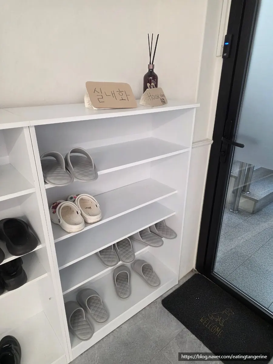 Entrance with separate outdoor shoes and indoor slippers
