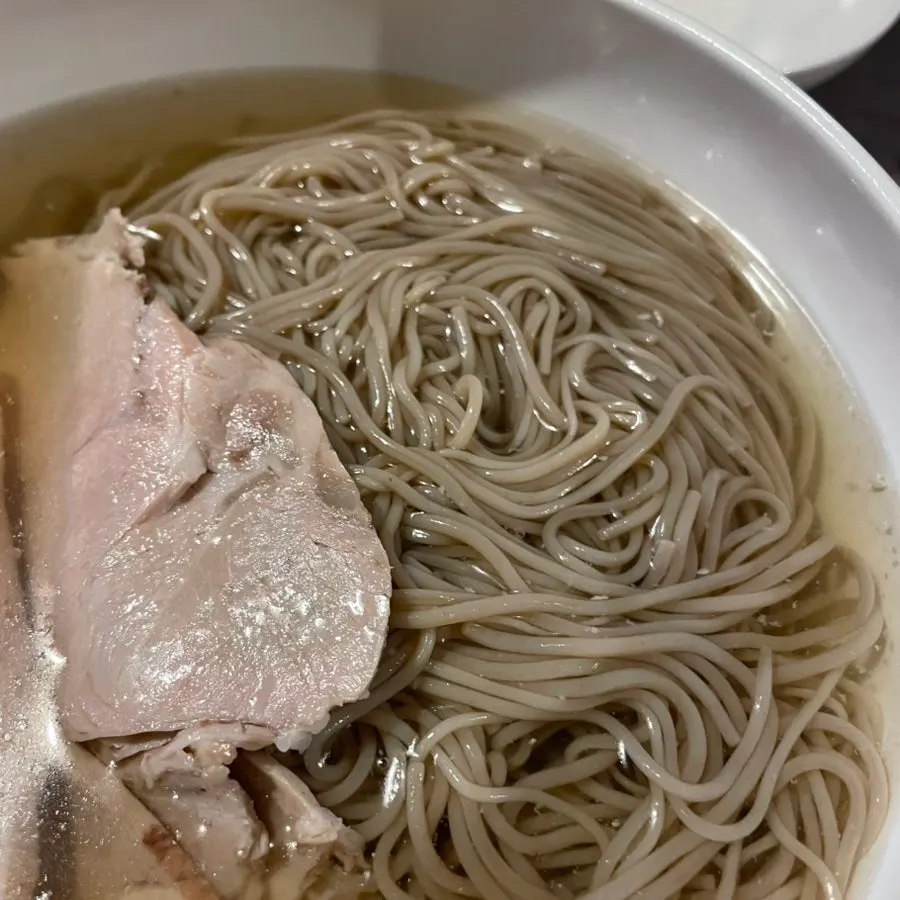 Anok's Pyeongyang naengmyeon topped with a large slice of cold pork