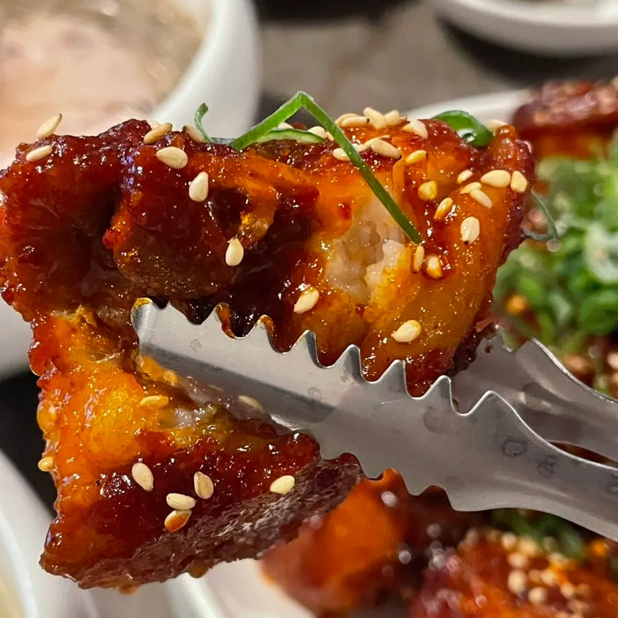 Close-up of pork tail jjim sprinkled with sesame seeds