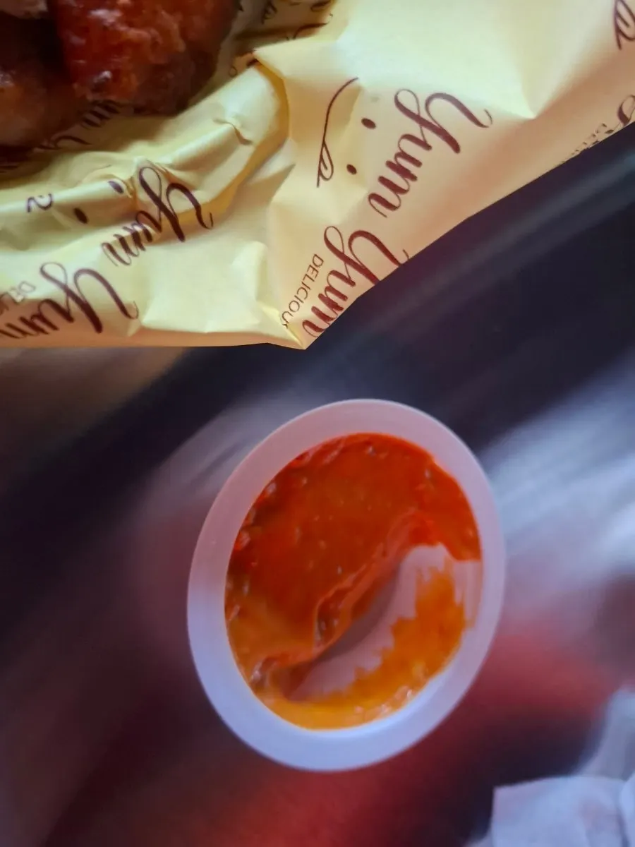 Cup of Gobling sauce with grilled chicken