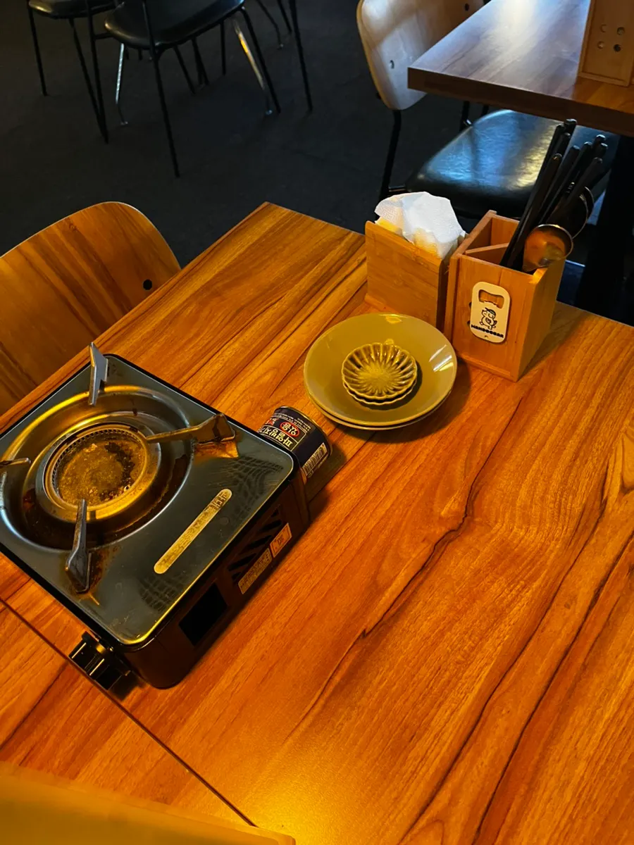 A neatly arranged table at MANDOO BAR