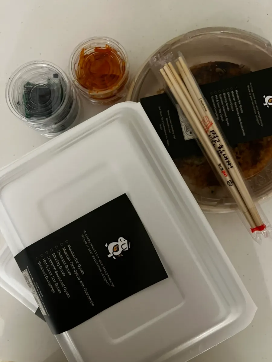 MANDOO BAR gyoza packed in a takeout container