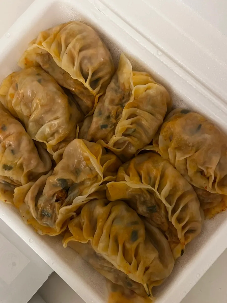 Close-up of a plump, carefully made steamed dumpling