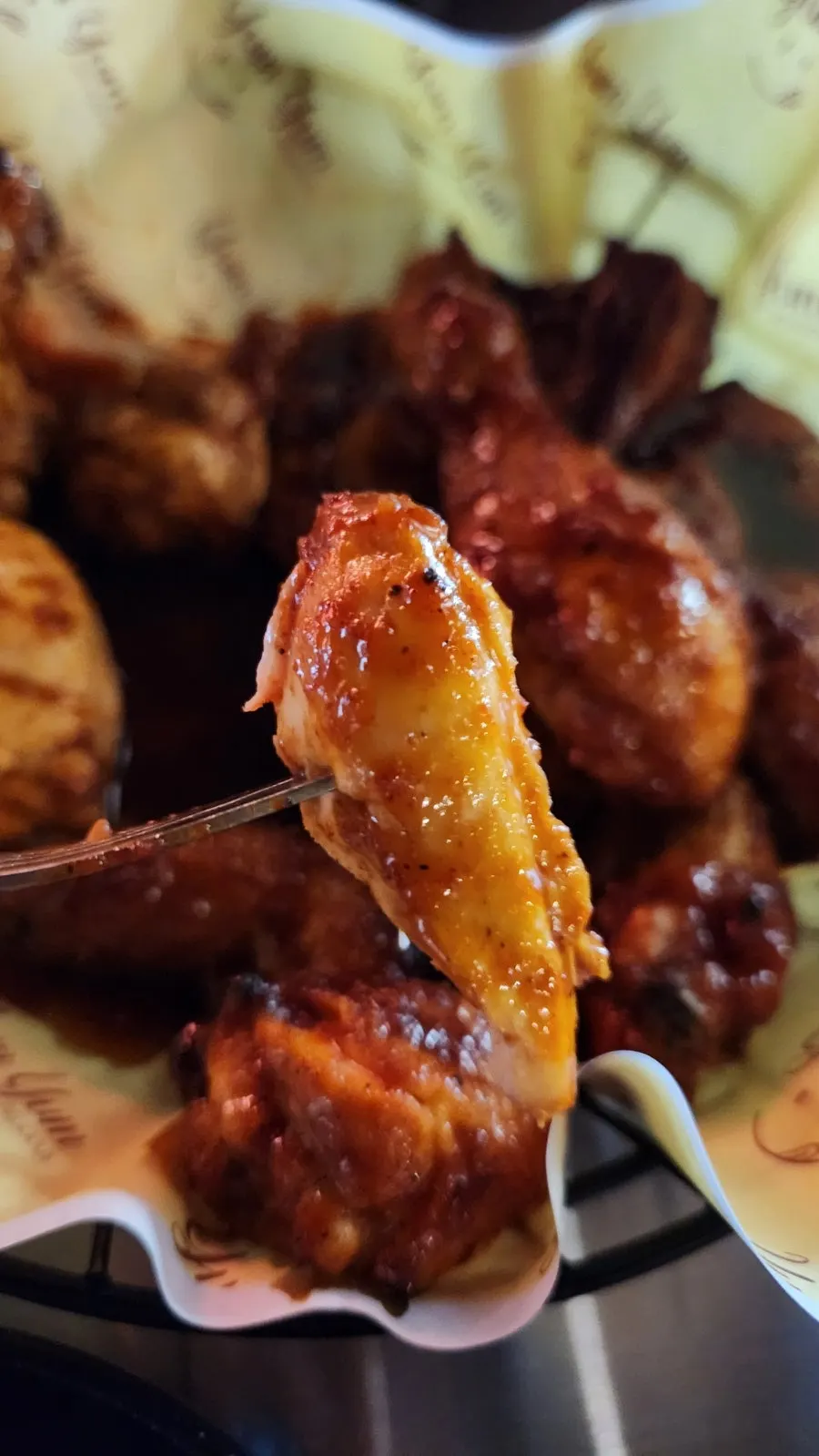 A piece of Volcano chicken dipped in Magma sauce