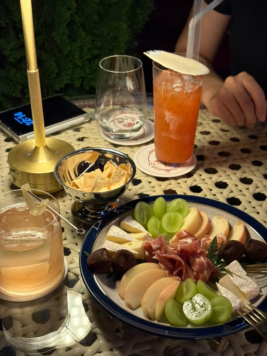 Close-up of the platter topped with peach and shine muscat grapes