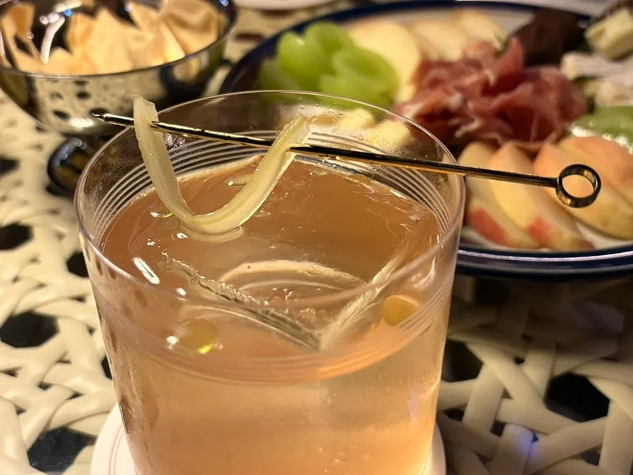 A glass of the Dream cocktail topped with chocolate