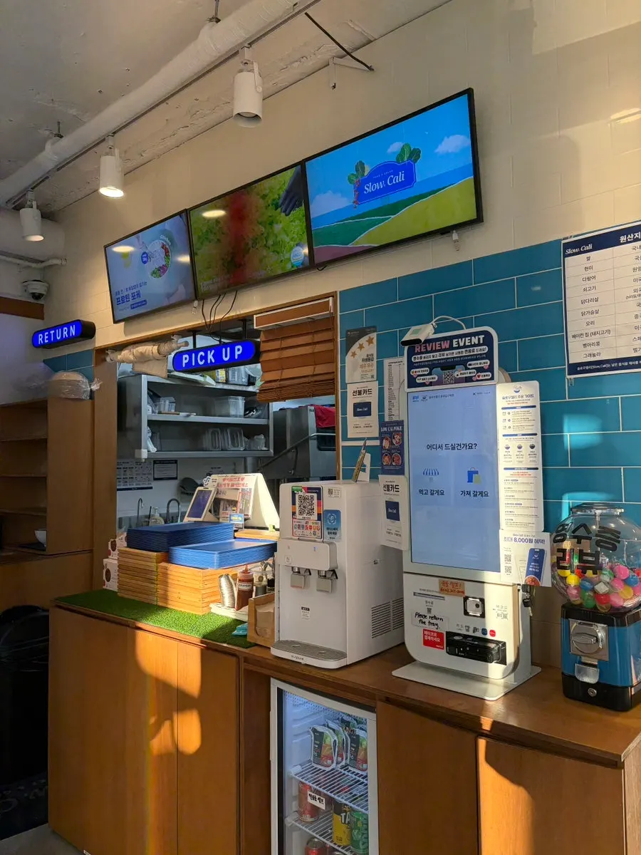 Counter and kiosk visible from the store entrance