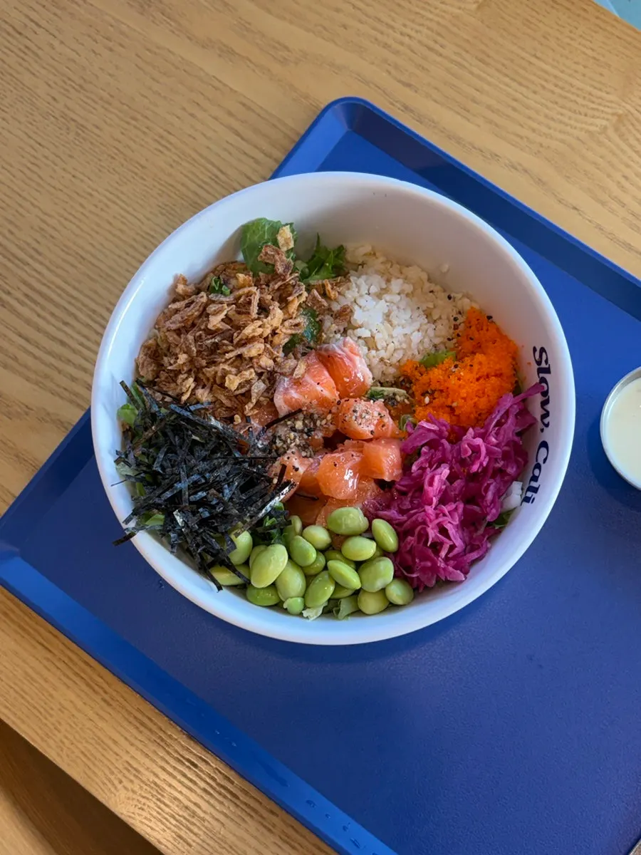 Poke bowl with brown rice and raw salmon