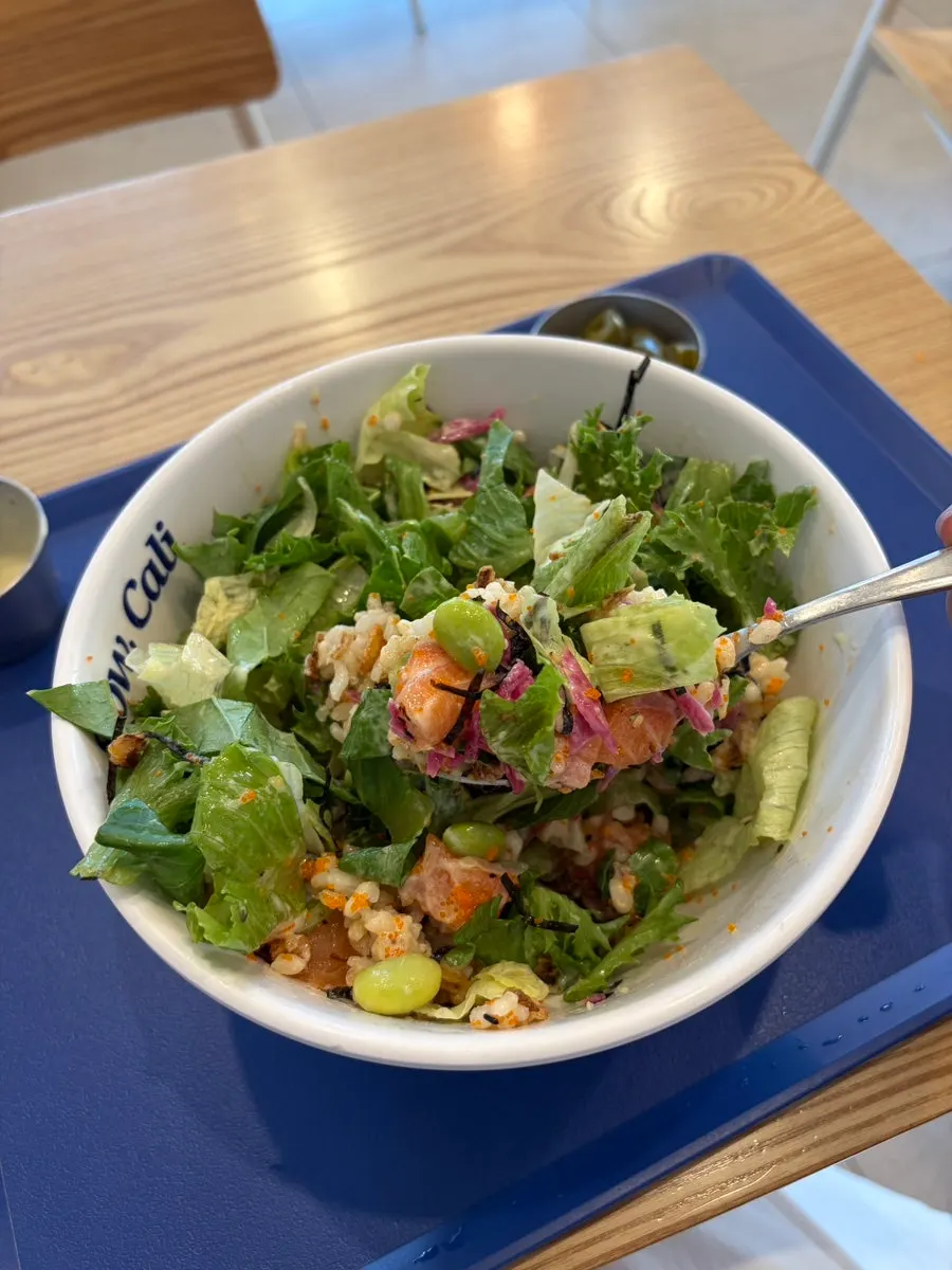 Salmon poke drizzled with wasabi ranch sauce