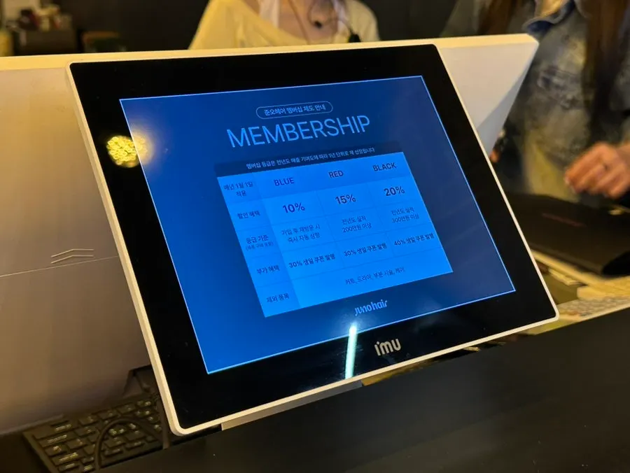 Juno Hair membership information displayed in-store