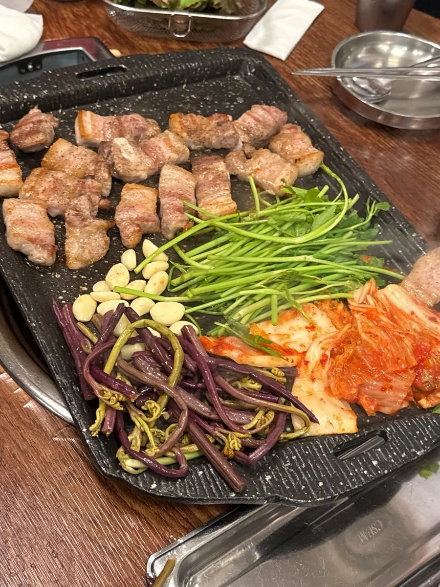 Meat served with bracken fern and water dropwort