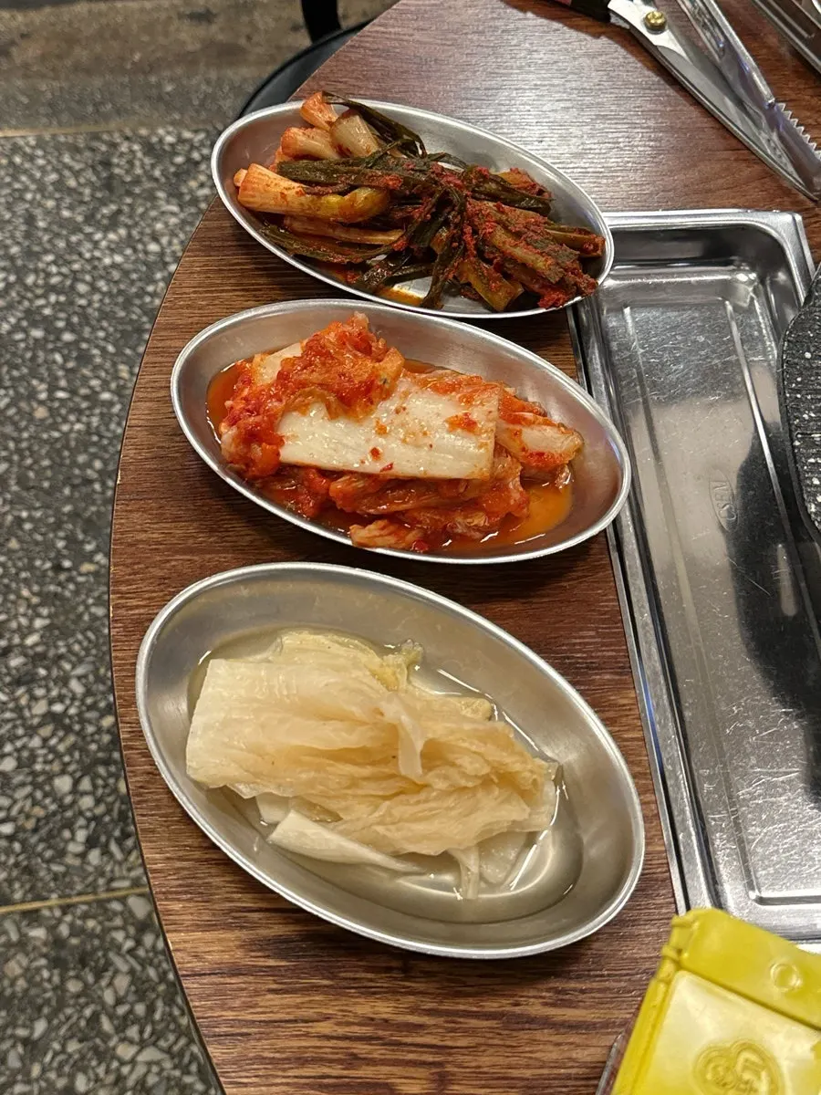 Jeolla-style scallion kimchi placed on top of pork belly