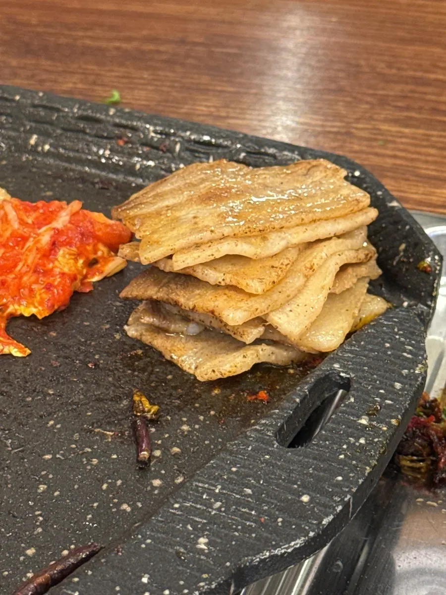 Frozen pork belly placed on the grill