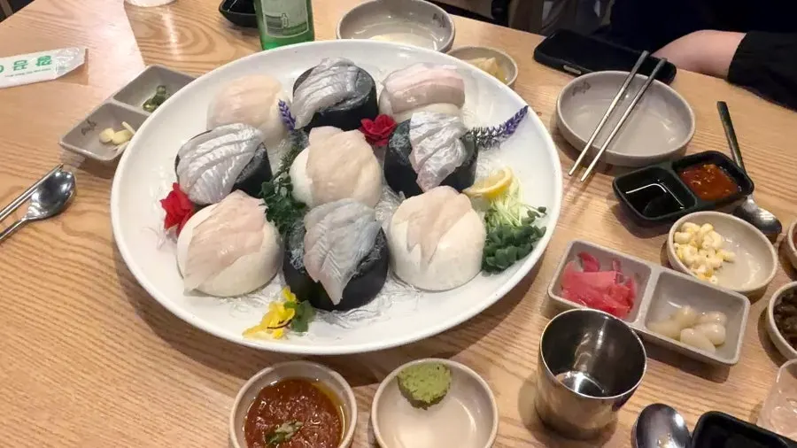 A plate of raw fish sashimi at Eosa Chulto Hongdae Branch