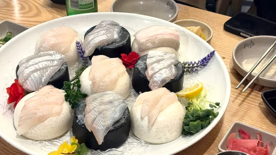 Sashimi dipped in soy sauce