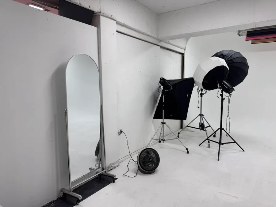 Prop corner in Studio B with large hearts, flowers, and a mirror ball