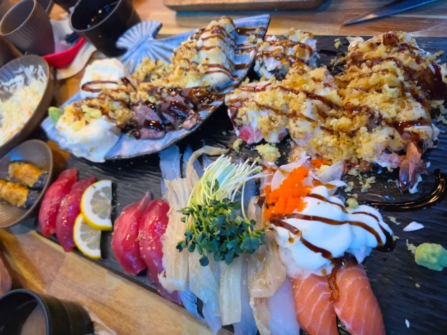 Complimentary fried eggplant sushi