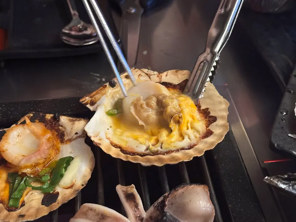 Plate of grilled cheese scallops